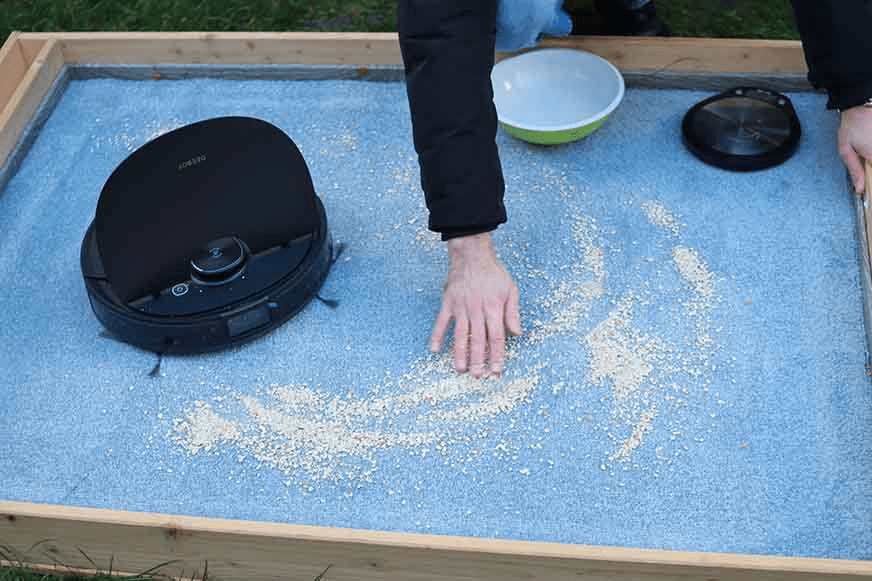 Distributing dirt across testing area